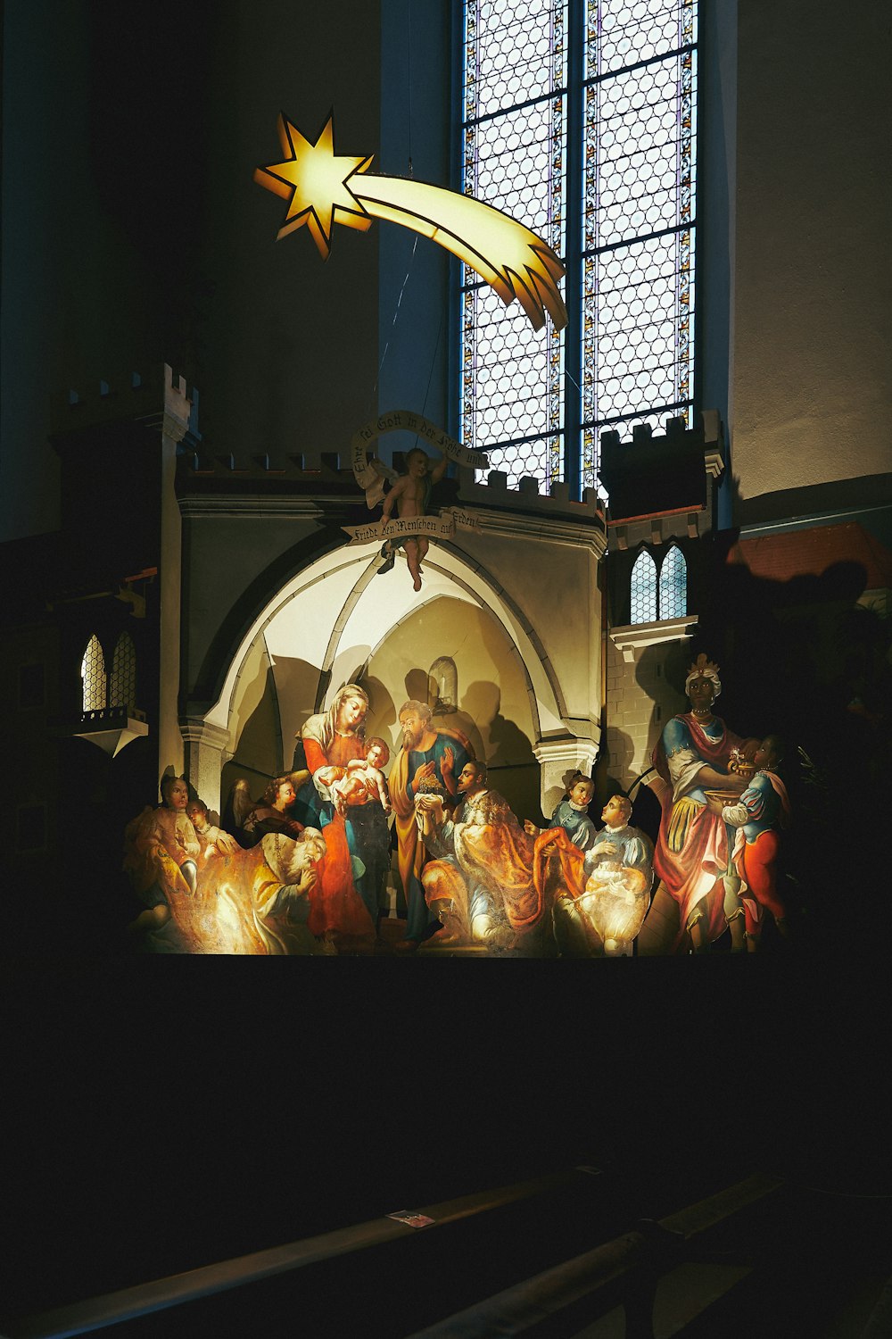 a nativity scene with a star above it