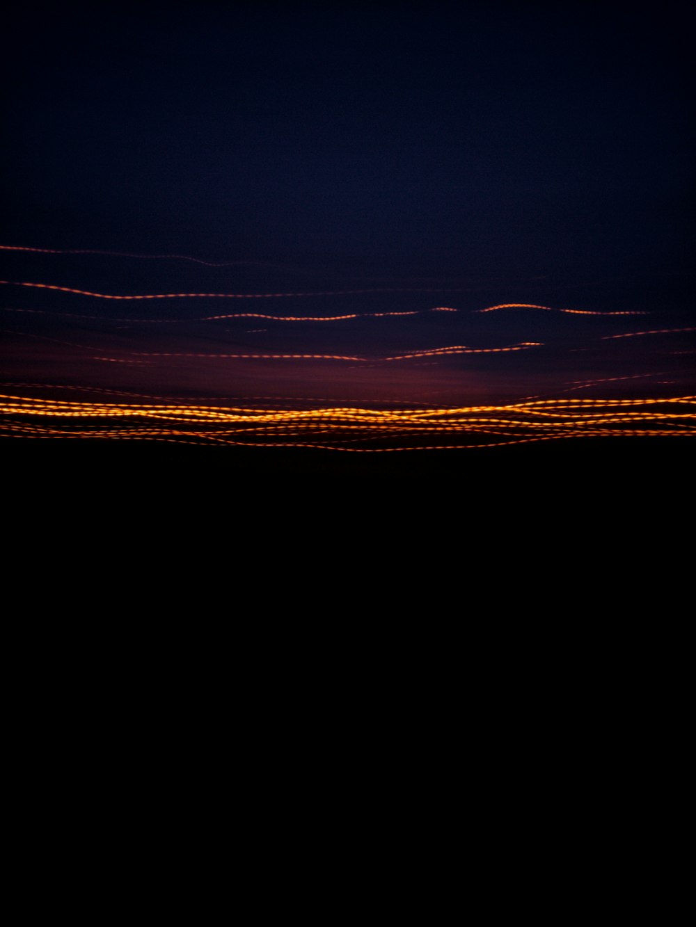 a plane flying in the sky at night