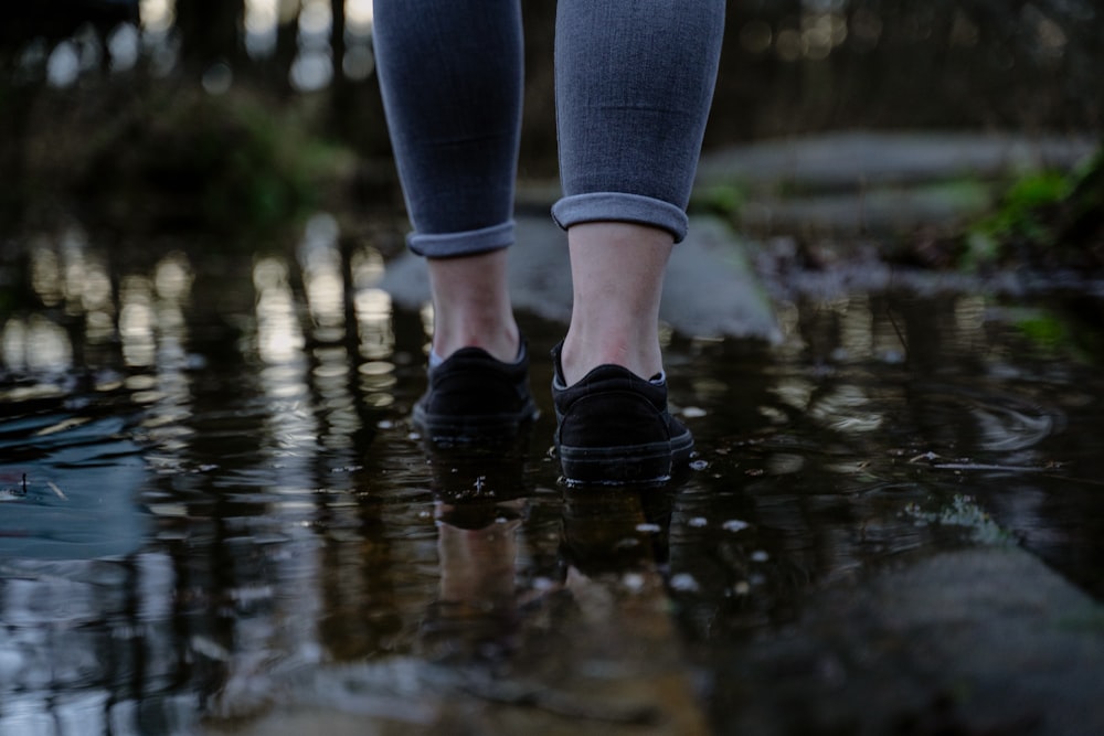 a close up of a person's feet in water