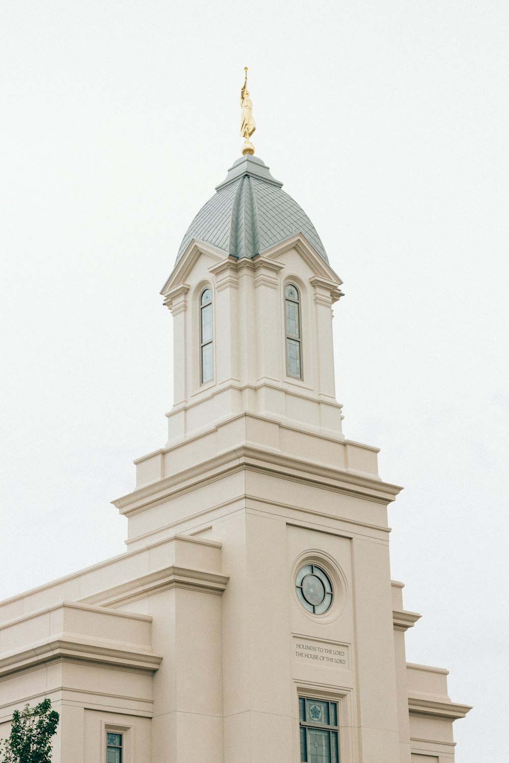 a large white building with a clock tower