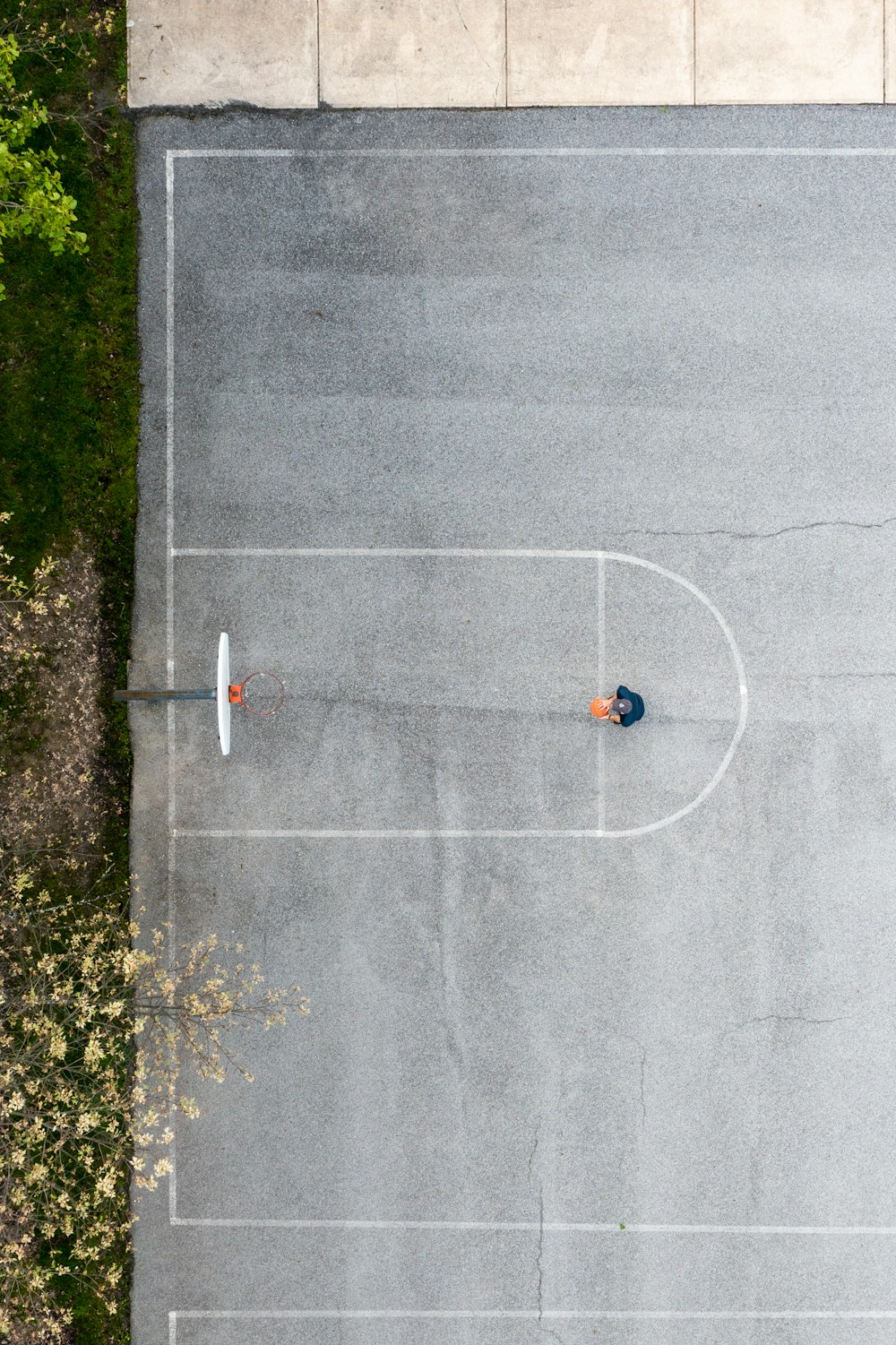 two people are standing on a basketball court