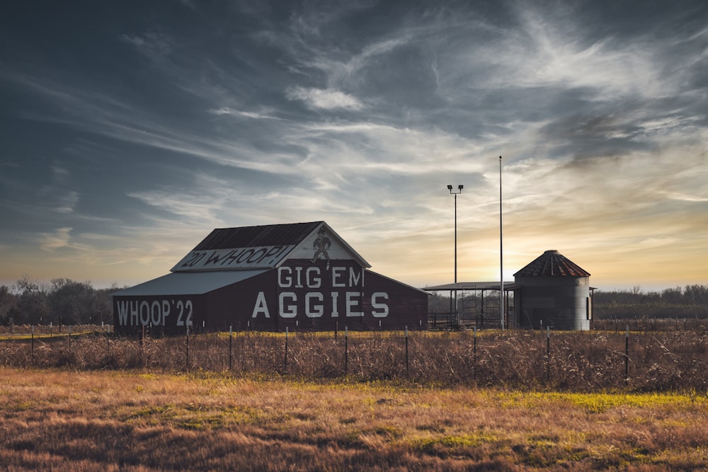 a barn with a sign on the side of it