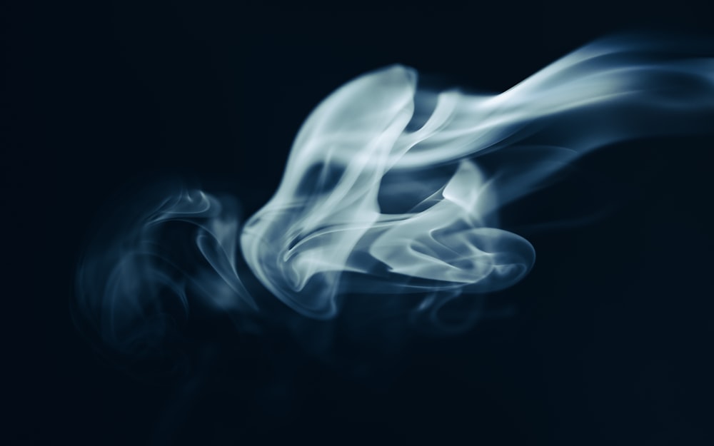 a blurry photo of smoke on a black background