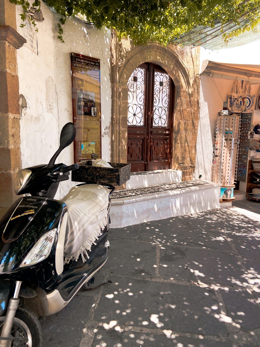 a scooter parked on the side of a street