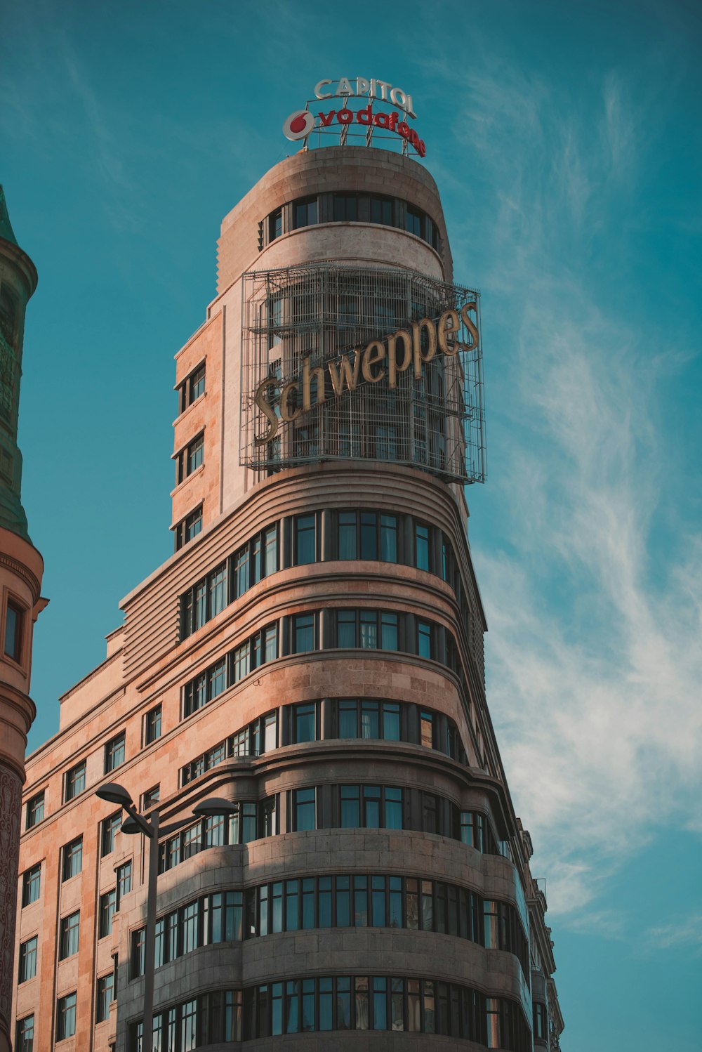 a tall building with a sign on top of it