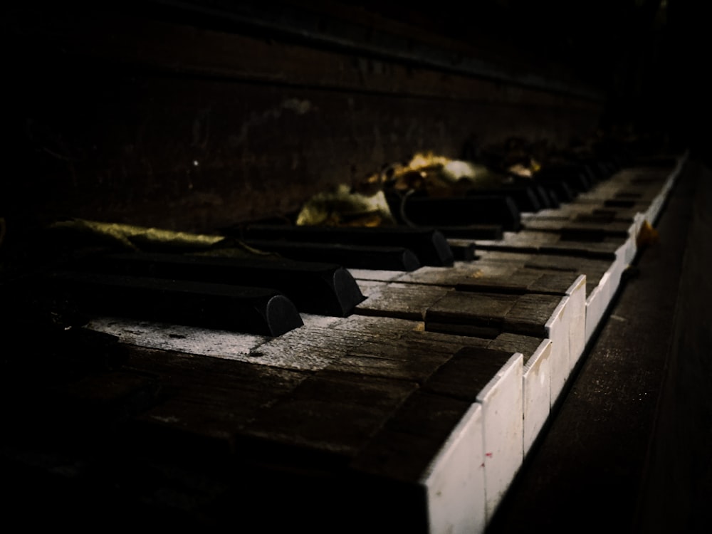 a close up of a piano in a dark room