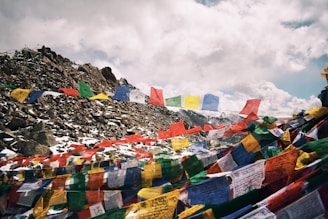a mountain covered in lots of colorful flags