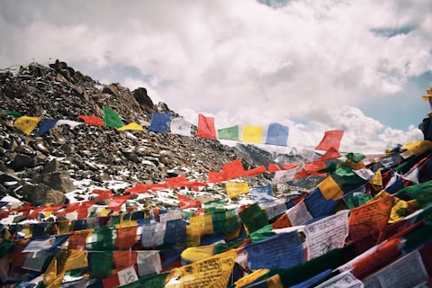a mountain covered in lots of colorful flags