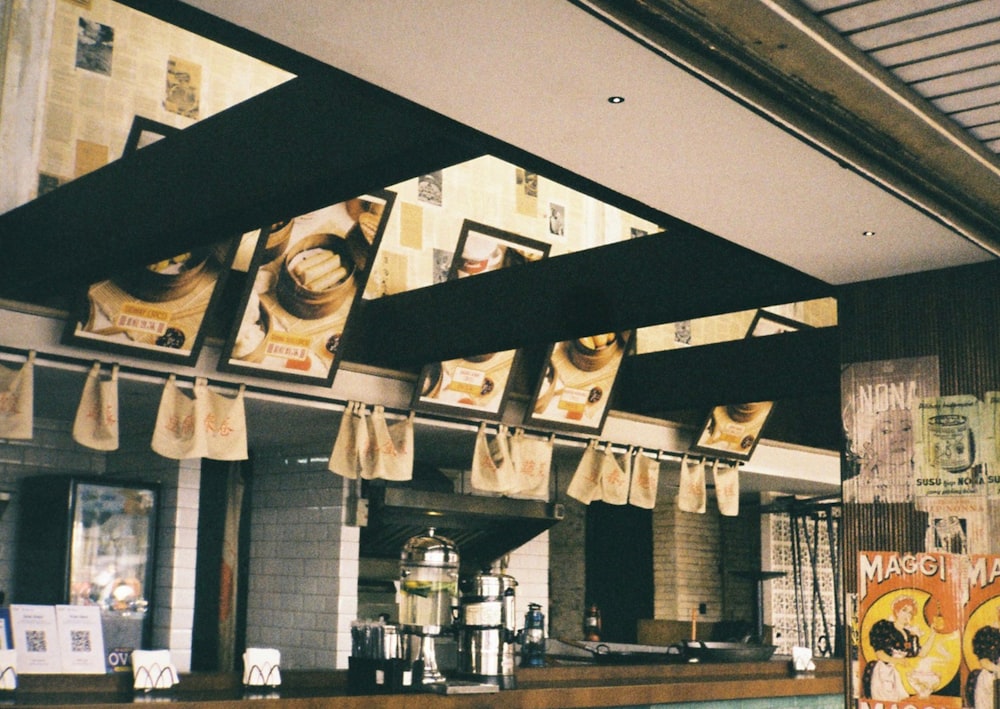 a restaurant with a bunch of bags hanging from the ceiling