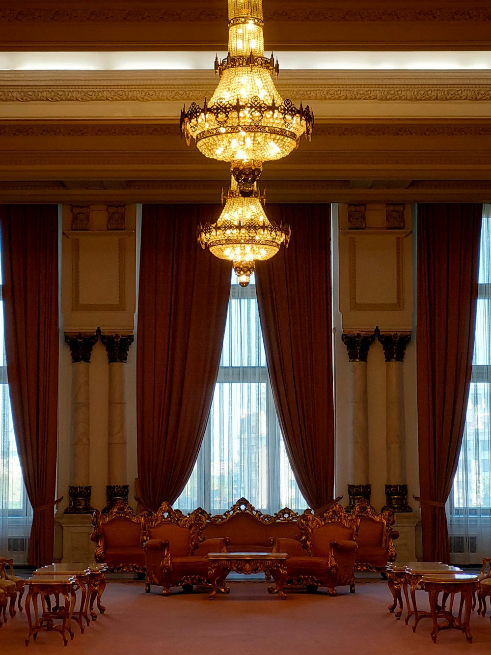 a chandelier hangs from the ceiling in a large room