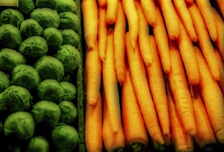 Close-up of fresh fruits and vegetables neatly arranged in a market display.