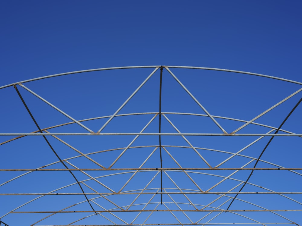 a metal structure with a blue sky in the background