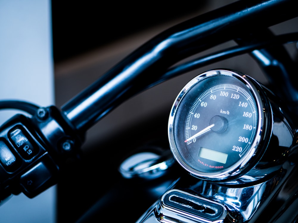 a close up of a speedometer on a motorcycle