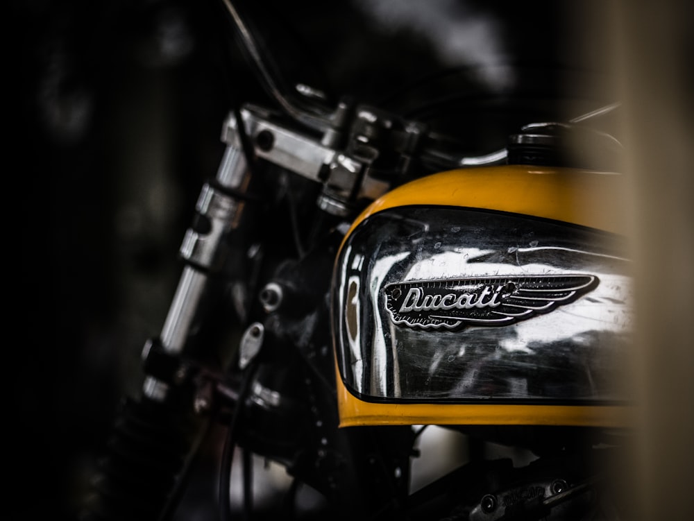 a close up of a yellow and black motorcycle