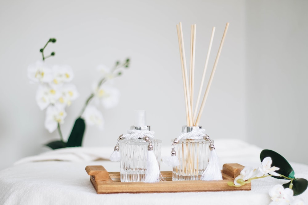 a couple of bottles sitting on top of a wooden tray