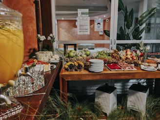 a wooden table topped with lots of food