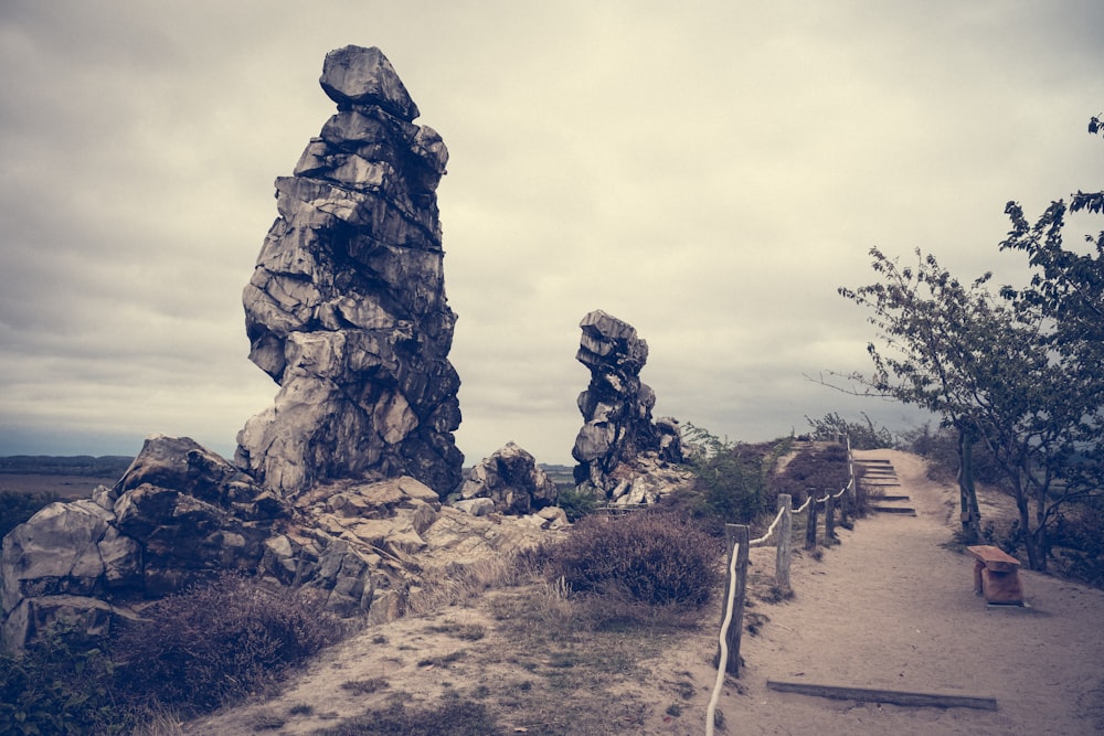 a path leading to a large rock formation