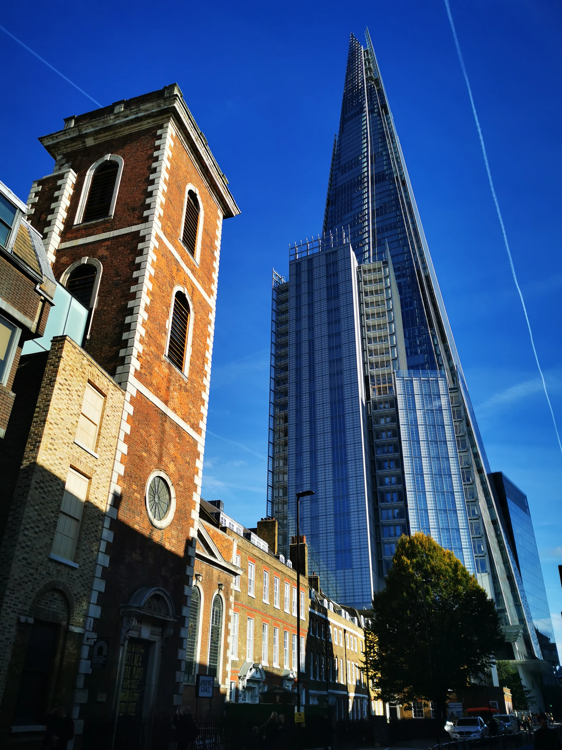 a very tall building next to a very tall building