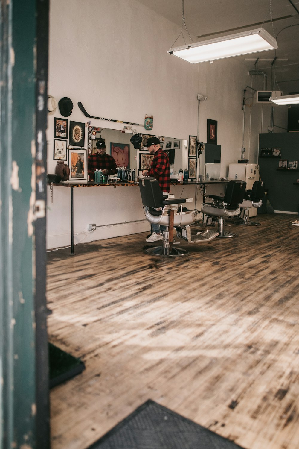 a barber shop with a chair and a hair dryer
