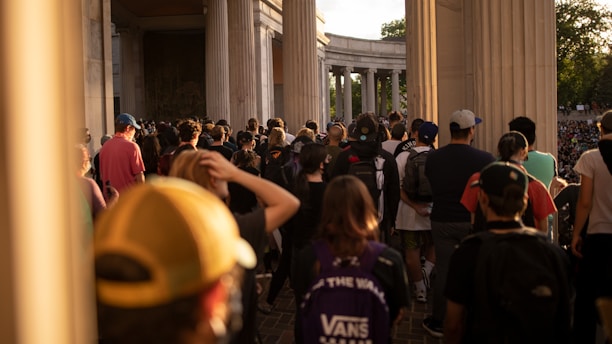 a large group of people walking down a street