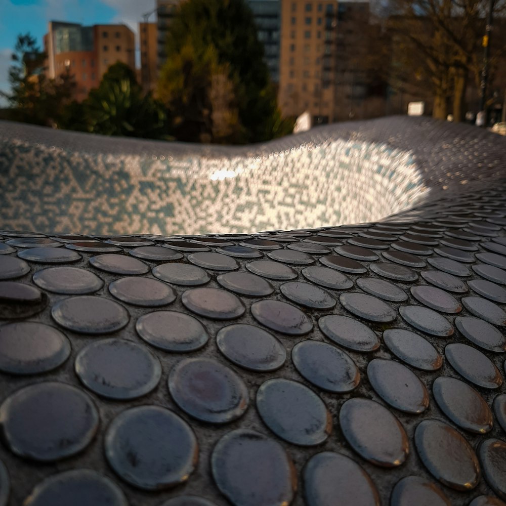 a close up of a skateboard ramp in a city