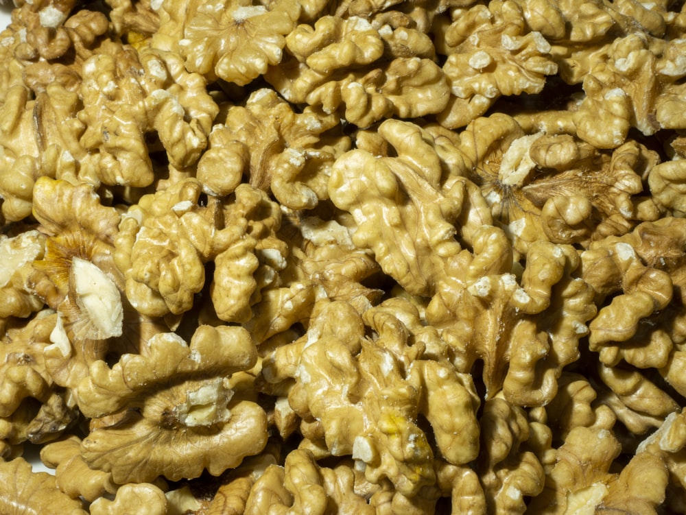 a pile of walnuts sitting on top of a table