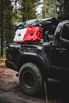 Toyota Tacoma ready for off-road trails in a forest setting.