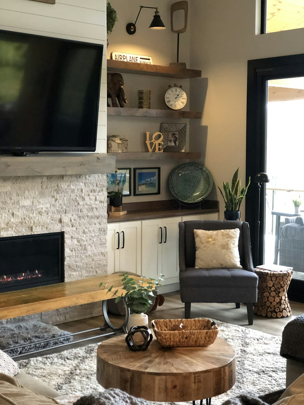 a living room filled with furniture and a flat screen tv