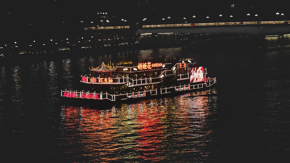 a large boat floating on top of a body of water