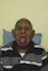 an old man sticking his tongue out