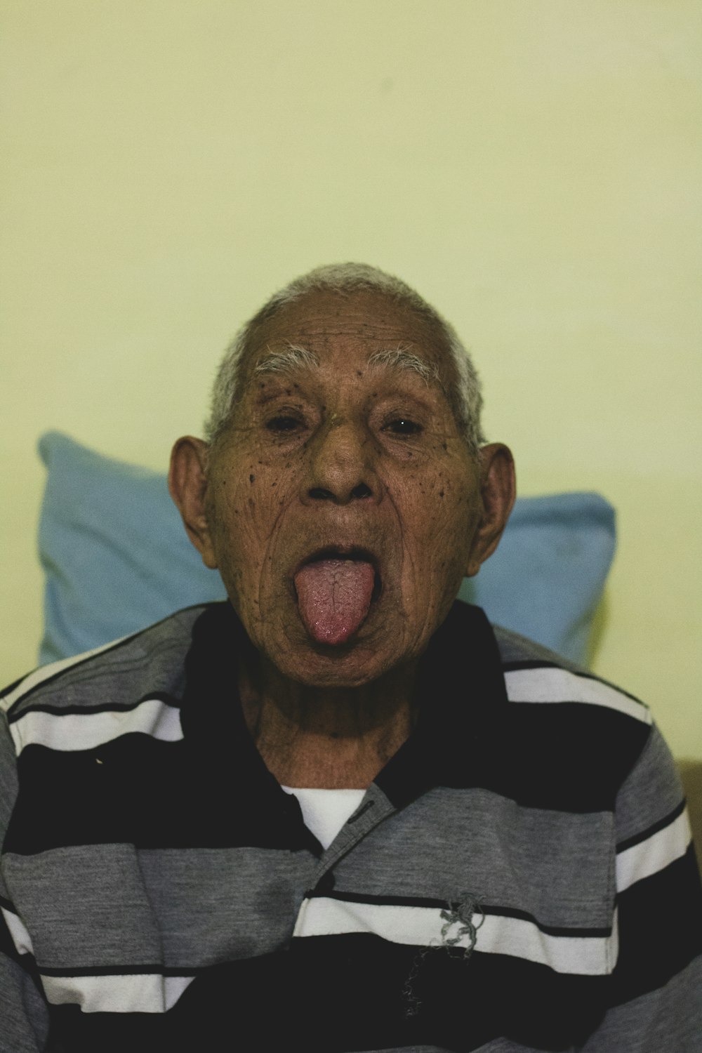an old man sticking his tongue out