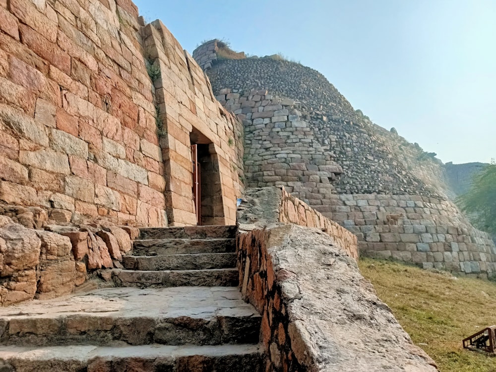 a stone staircase leading up to a stone building