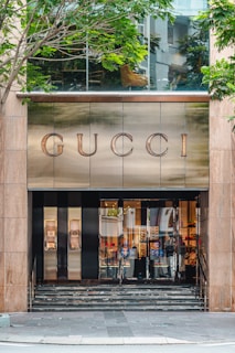 the entrance to a gucci store in a city