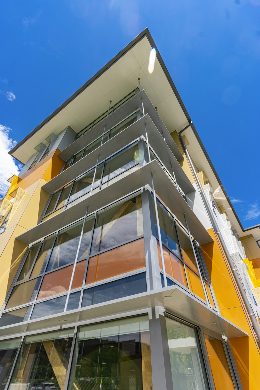 a multi - colored building with a blue sky in the background