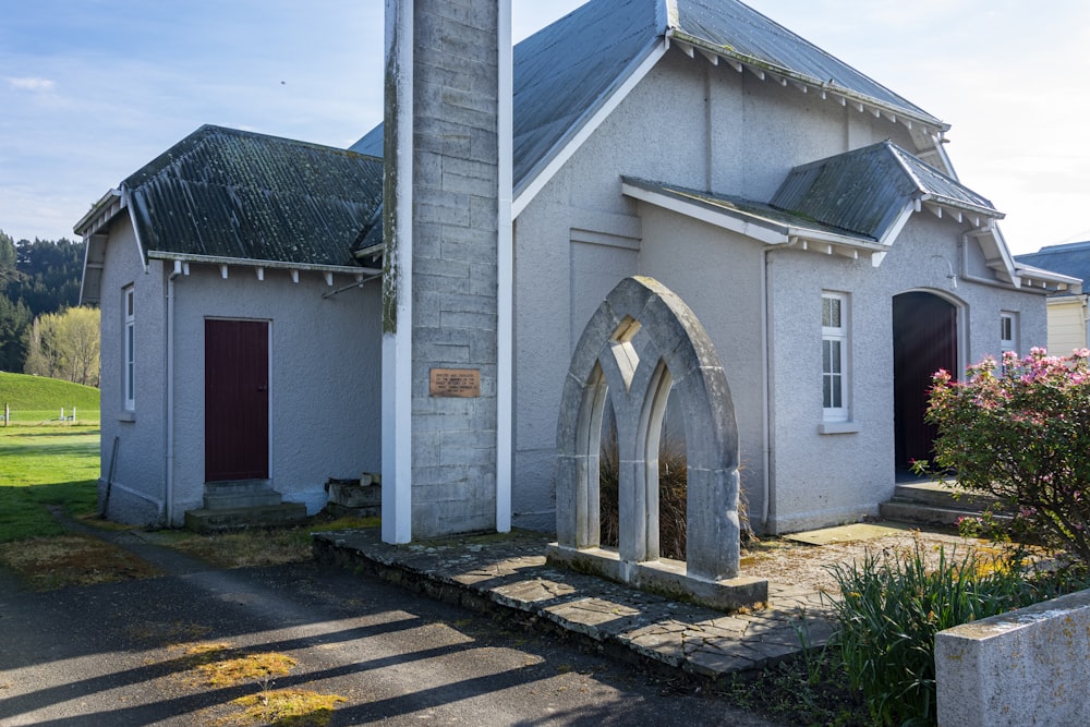 a small church with a steeple and a bell tower