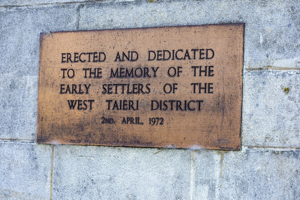 a plaque on the side of a building