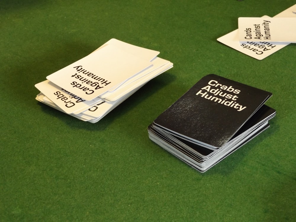 a table topped with lots of black and white cards