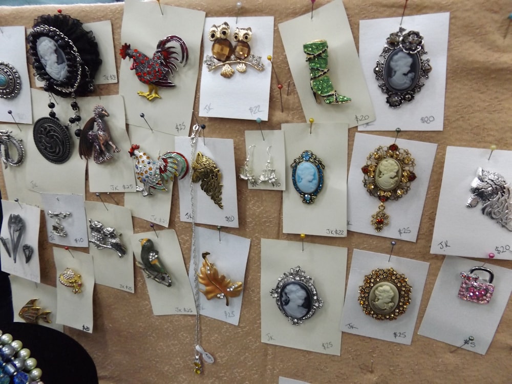 a bunch of jewelry is hanging on a wall