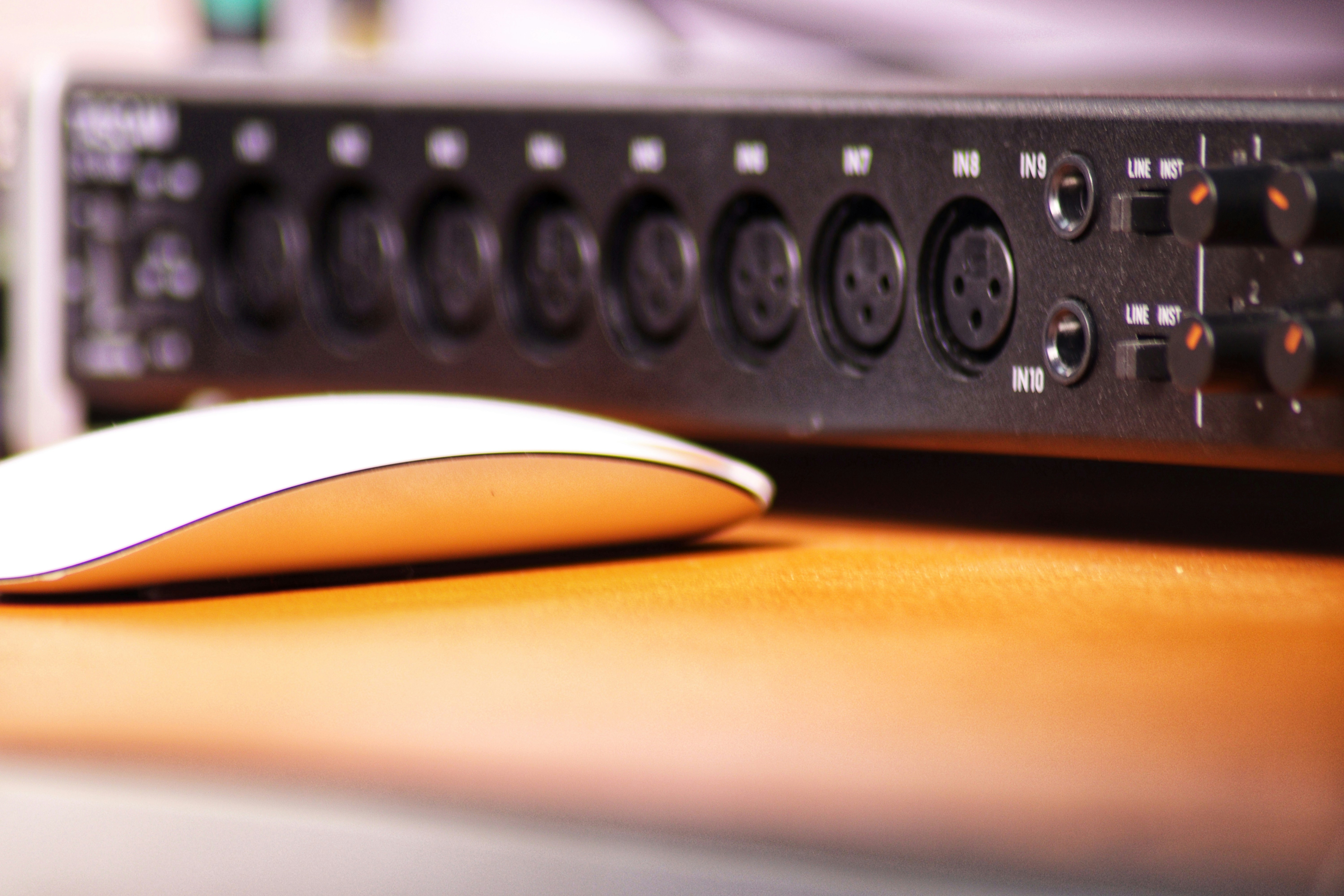 a computer mouse sitting on top of a wooden table