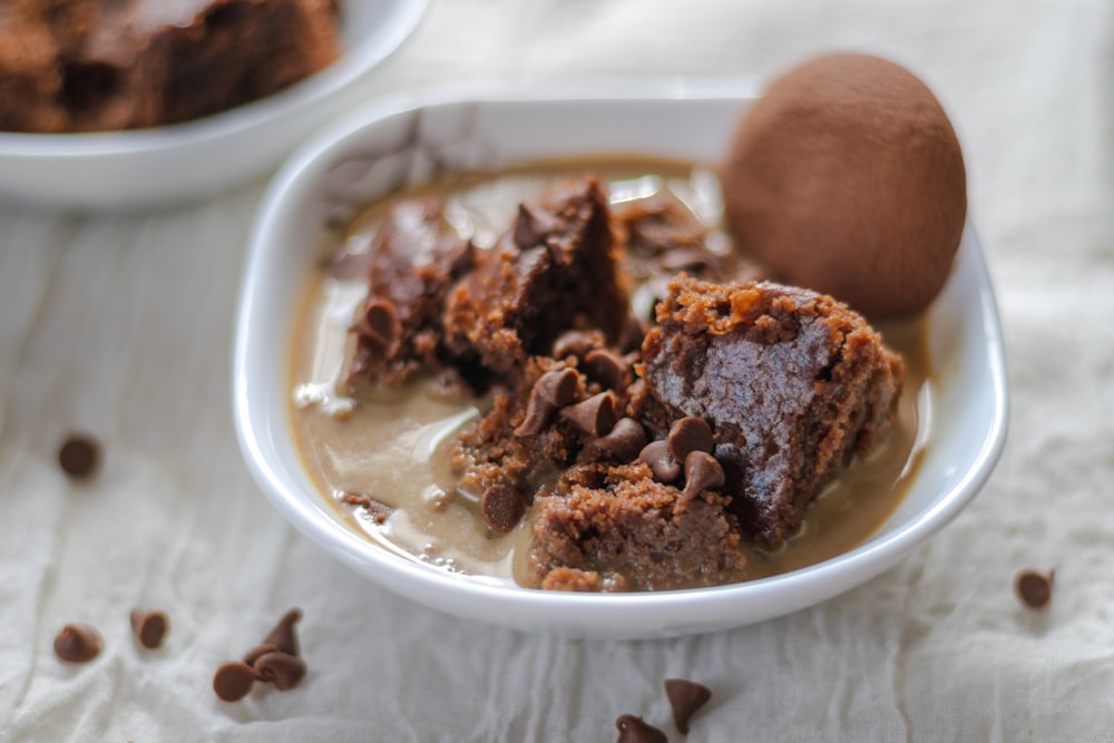 a white bowl filled with pudding and chocolate