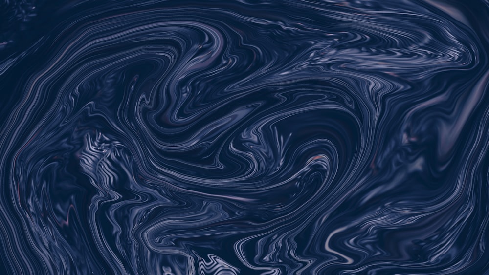 a blue and black background with swirls