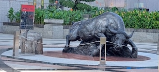 a statue of a bull in a courtyard