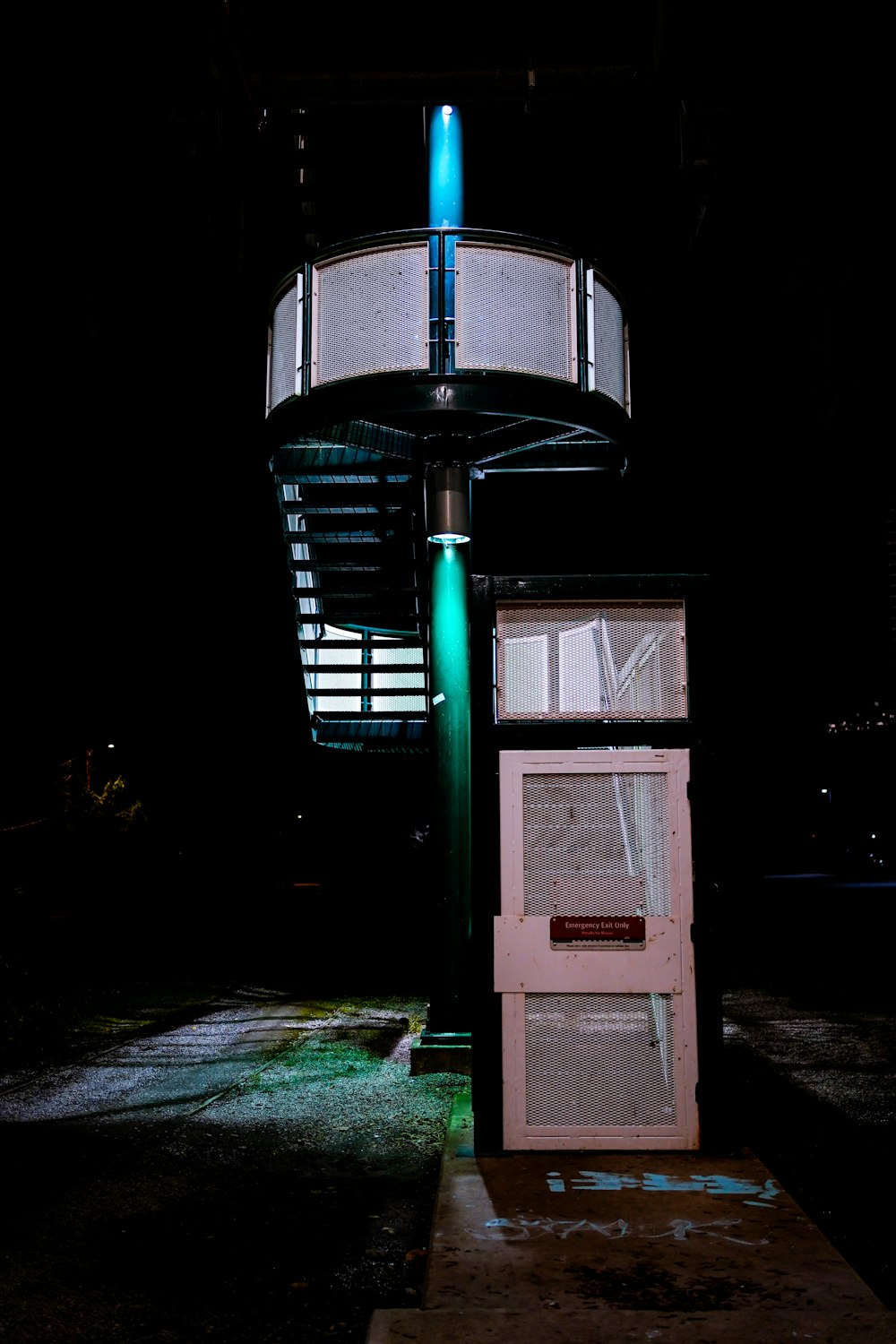 an old refrigerator sitting in the middle of a parking lot