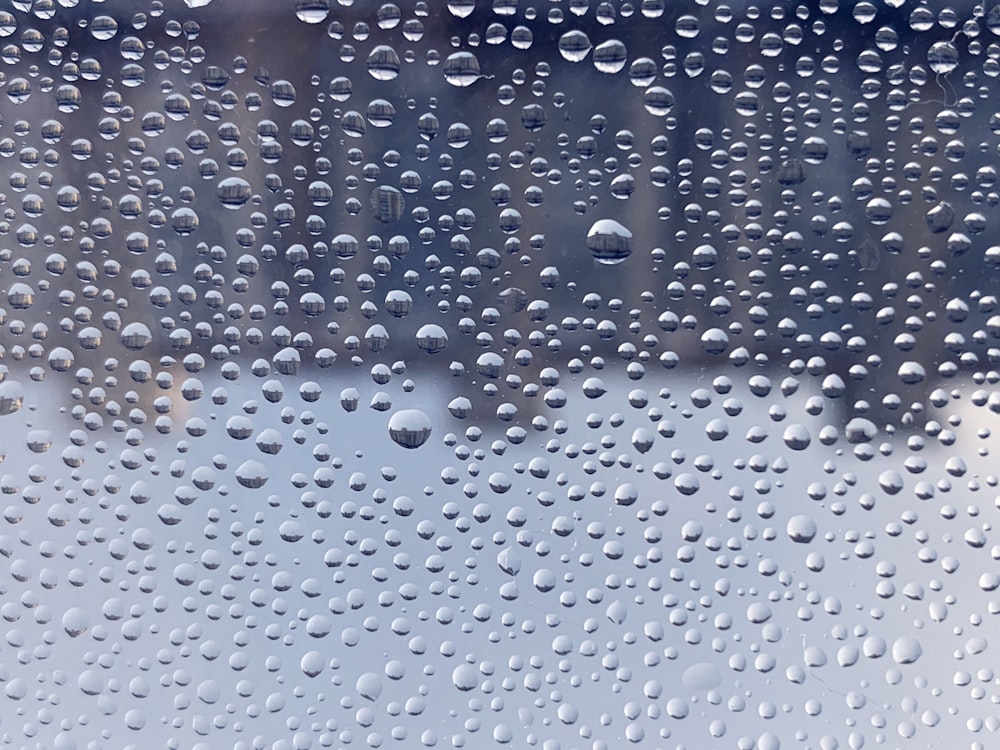 a close up of a window with rain drops