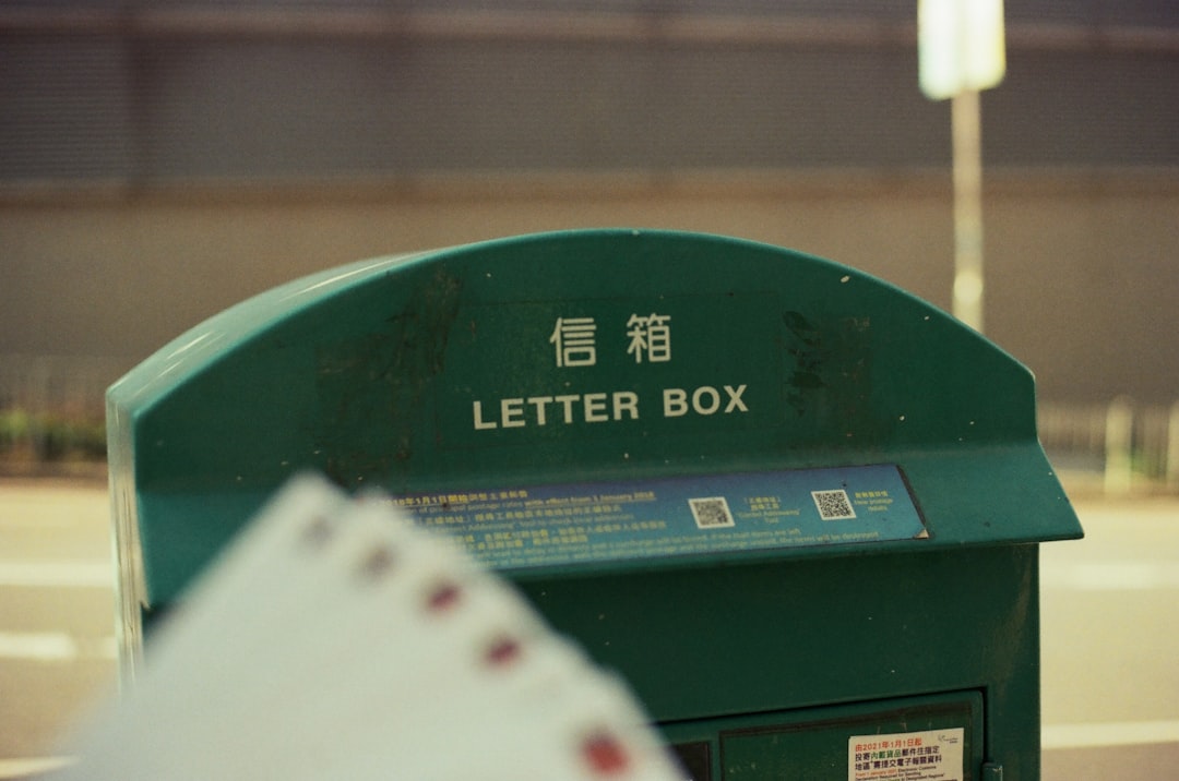 a green box with a lot of cards in it, Sending letters during the pandemic.