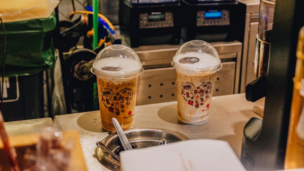 a couple of cups that are sitting on a counter