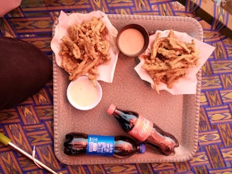 A colorful tray filled with a variety of Meal For You fast food items, ready to be shared.