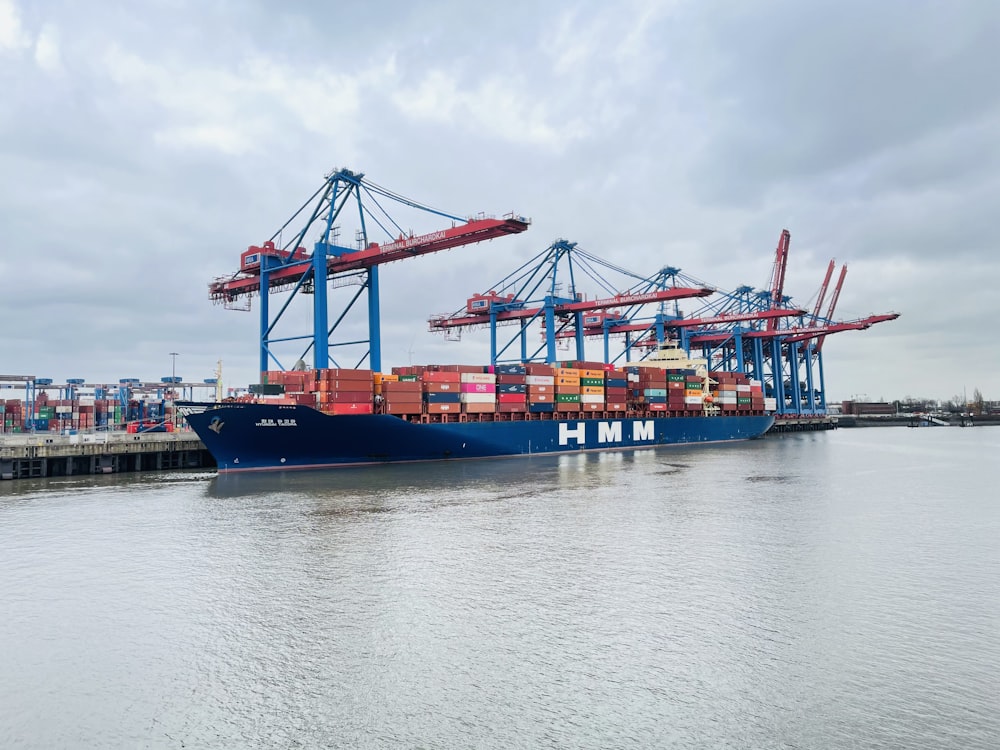 a large cargo ship docked at a dock