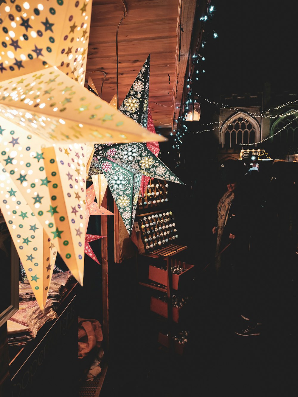 a group of stars hanging from the ceiling of a building