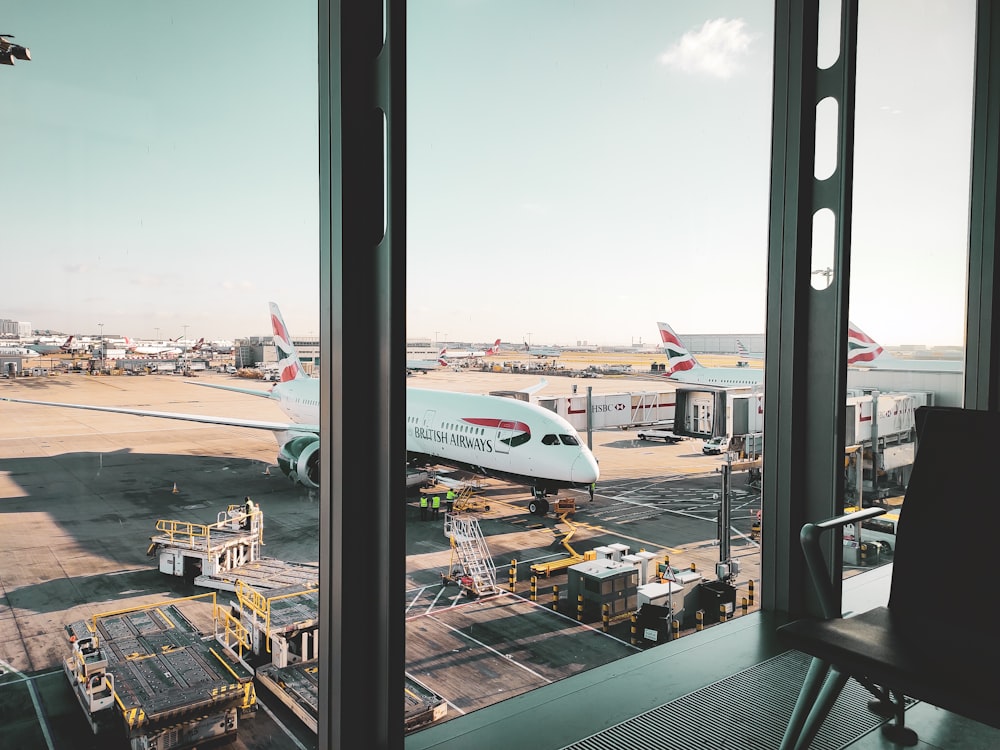 a large jetliner sitting on top of an airport tarmac